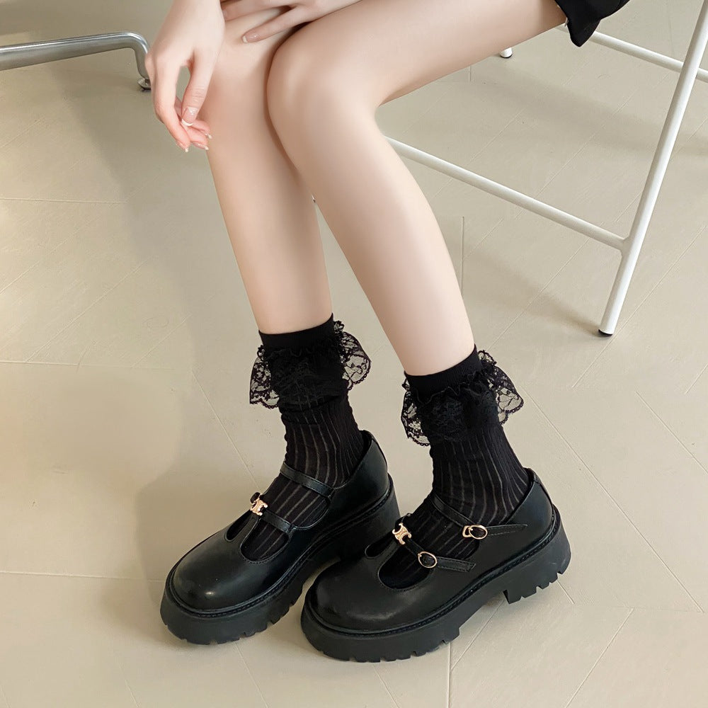 Untouched original reference of Black lace-flounce socks worn with shoes, showing semi-sheer vertical rib channels and a single Black lace skirt below the plain opening.