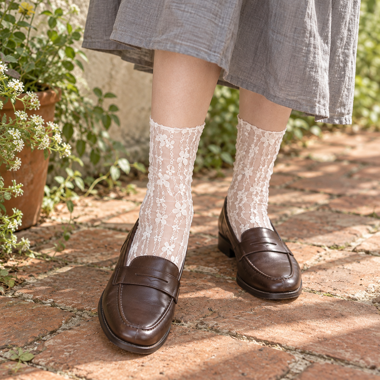 AI editorial illustration of White flower-chain sheer socks with brown loafers and a gray skirt on a brick path.