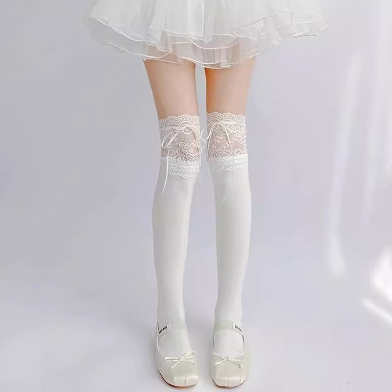 White long socks with wide floral lace cuffs and white ribbon detail, worn with Mary Janes