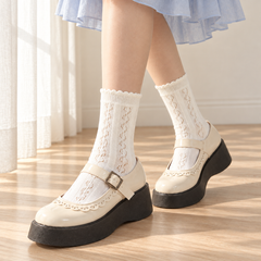 AI styling illustration of Milky White leaf-eyelet socks with a powder-blue skirt and cream Mary Jane shoes
