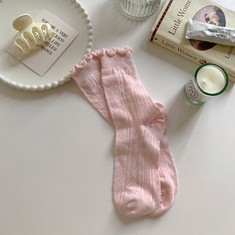 Pink socks with leaf-like openwork and ruffled cuff edges
