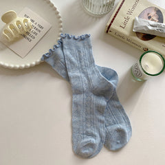 Blue socks with leaf-like openwork and ruffled cuff edges
