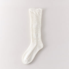 White long sock with three leaf pointelle sections, two broad textured bands and a geometric knit cuff