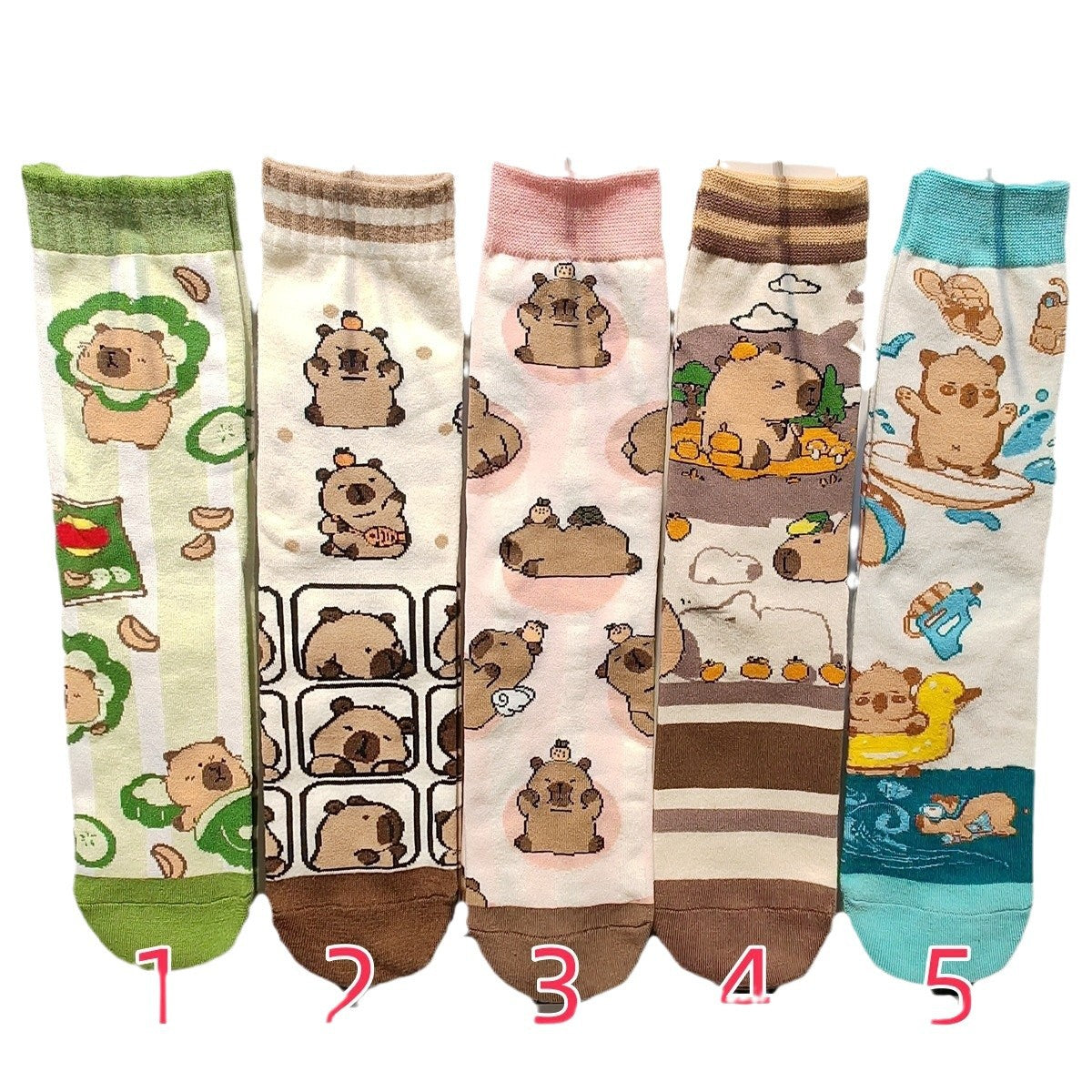 Capybara crew sock styles 1 to 5 laid flat with matching numbered labels, sold as one pair in the selected style