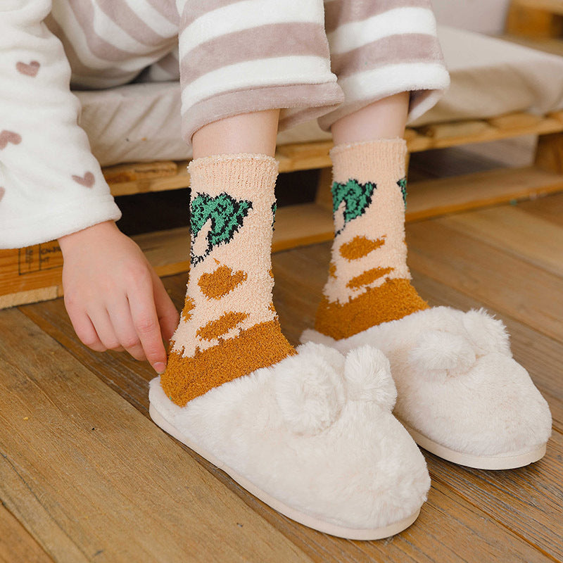 Orange Broccoli fuzzy crew socks worn with striped pajamas and white slippers, shown for styling