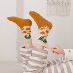 Pair of Orange Broccoli fuzzy crew socks worn with the orange feet and green broccoli motifs visible