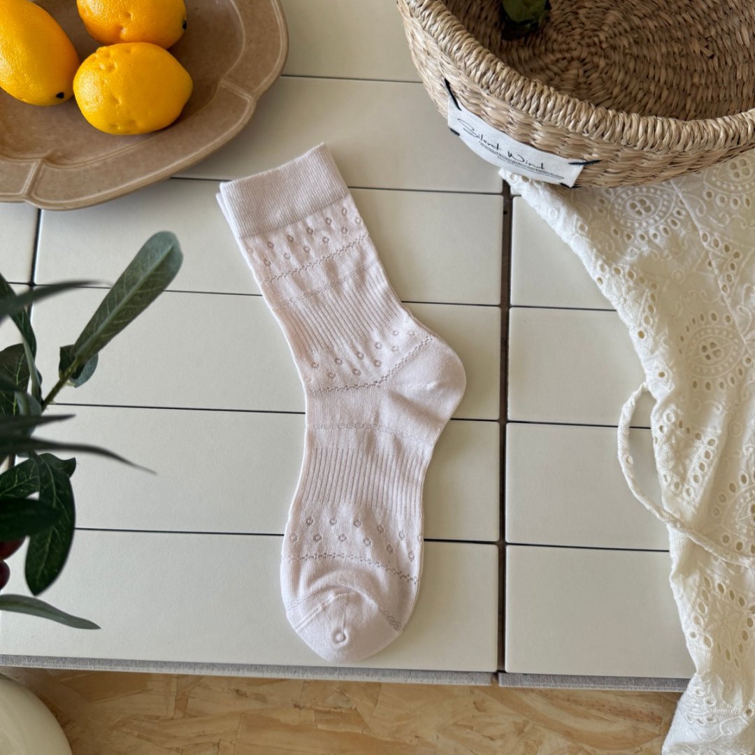 Pale Pink ribbed sock with a straight cuff and small eyelet bands
