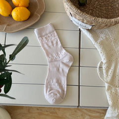 Pale Pink ribbed sock with a straight cuff and small eyelet bands