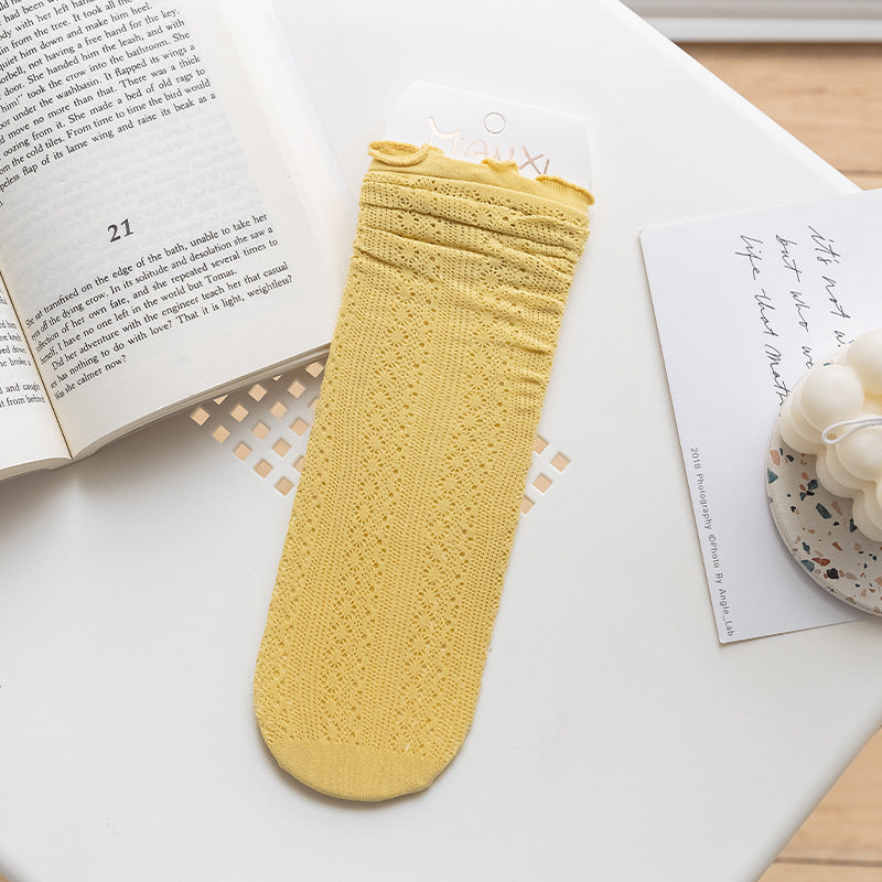 Yellow openwork socks with rippled cuff edges