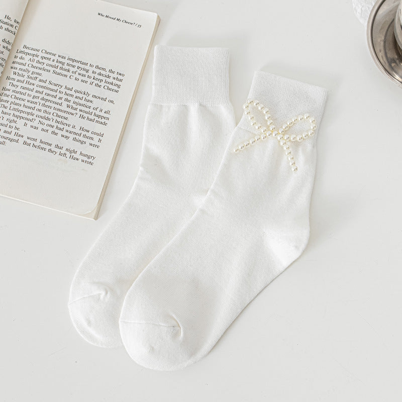 White Pearl Style Bow socks with a bead bow decoration shown on one sock