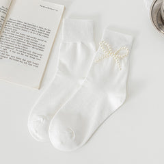 White Pearl Style Bow socks with a bead bow decoration shown on one sock