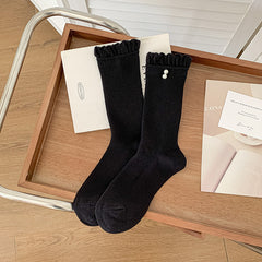 Black ribbed socks with frill cuff and pearl-style accents, selected one-pair option