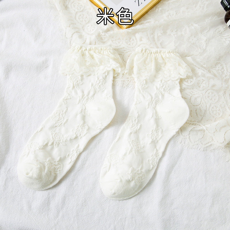 Original supplier reference of one Beige pair with raised floral vines and broad scalloped lace flounces