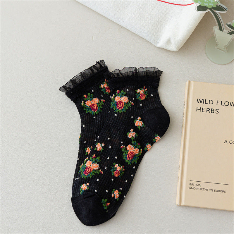 Rose bouquet sheer ankle socks in the selected Black color