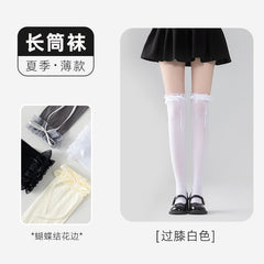 White long socks with gathered ruffle cuffs and ribbon tails, shown worn with Mary Janes beside color-reference insets