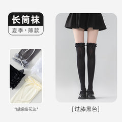 Black long socks with ruffle cuffs and ribbon tails