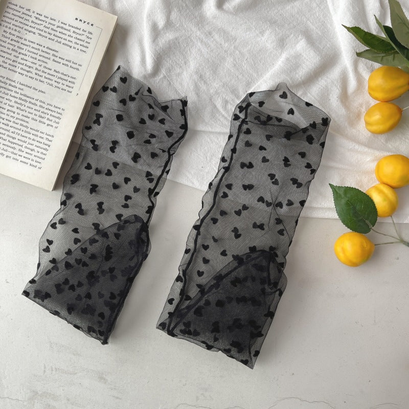 Scattered heart sheer crew-style socks in the selected Black color