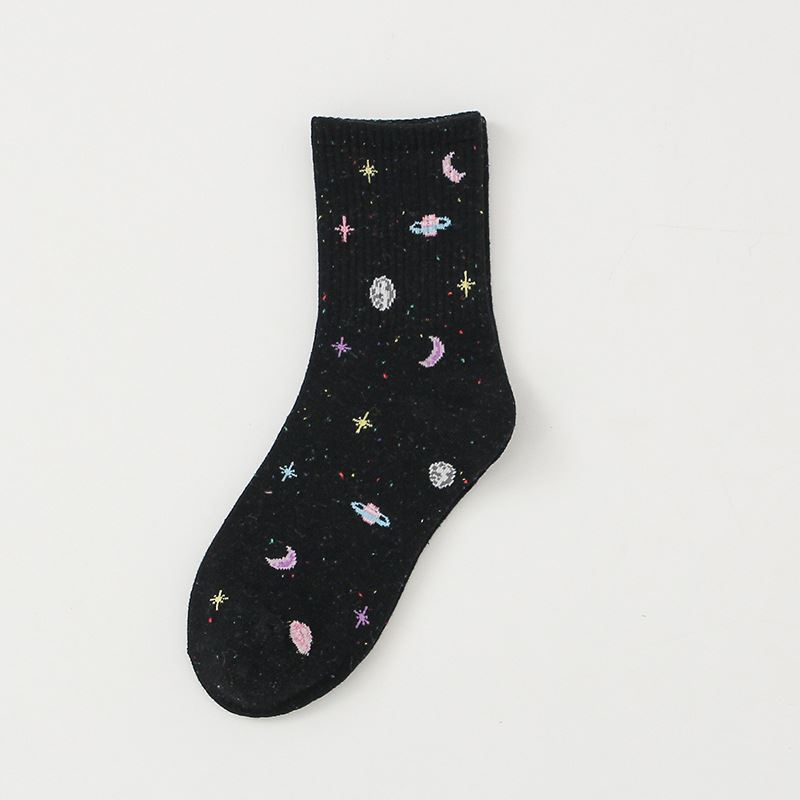 Black crew sock with colorful planets, crescent moons and stars