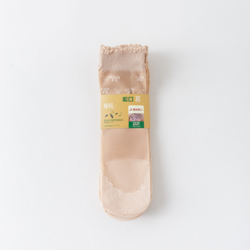 Light Nude sheer ankle socks with small white bow motifs, shown with original supplier packaging