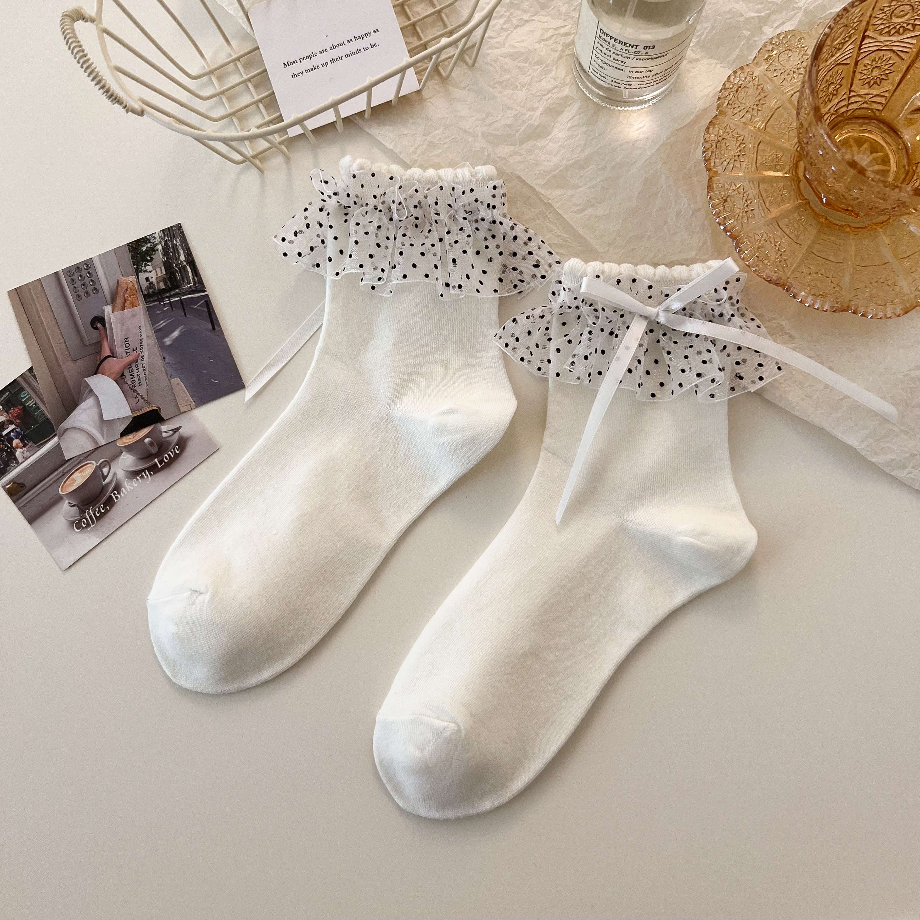 White ankle socks with black-dotted fabric cuff frills and long white ribbon details