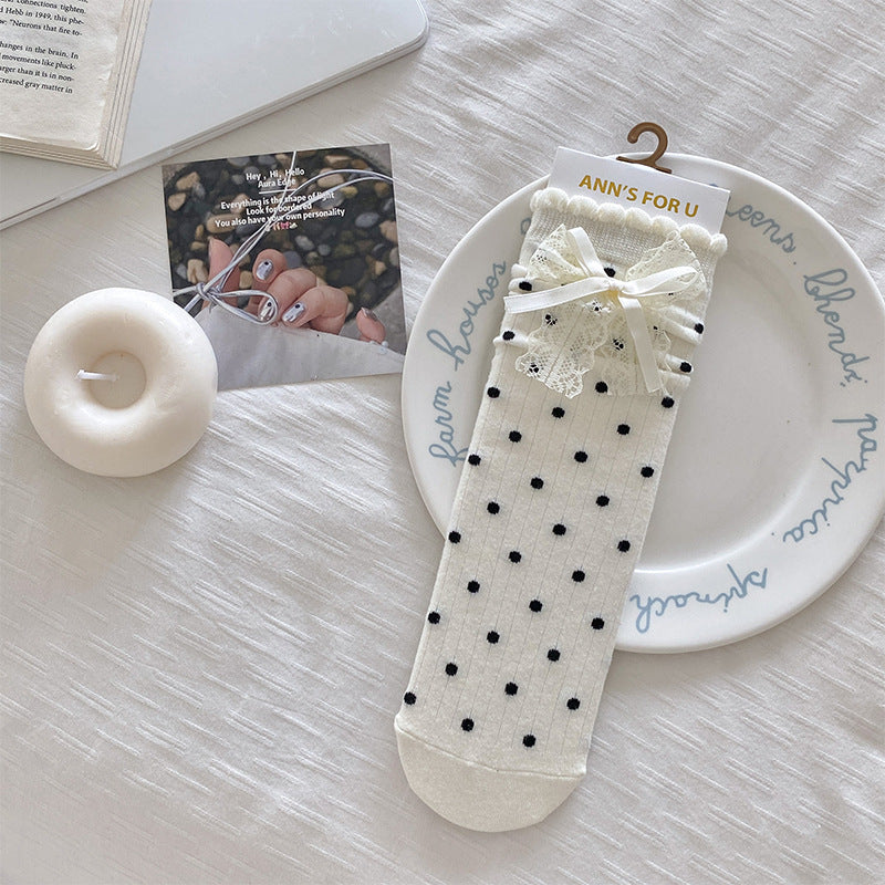 Original supplier photo of the White black-dot sock with layered white lace-and-ribbon bows; sold as one pair
